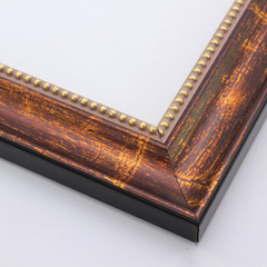 A simple, scooped profile wood frame that adds an elegant touch to your favourite photographs or artwork prints.  The bold, red-brown thickly overlies a gold foil base for a veined marble effect that meets an inner edge of gold foil beading and a gold foil drop edge. The sides of the frame are black.

2 " width: ideal for medium-size artworks.